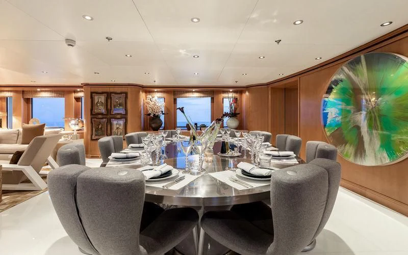 a large dining room with a large table and chairs aboard TREEHOUSE Yacht for Sale