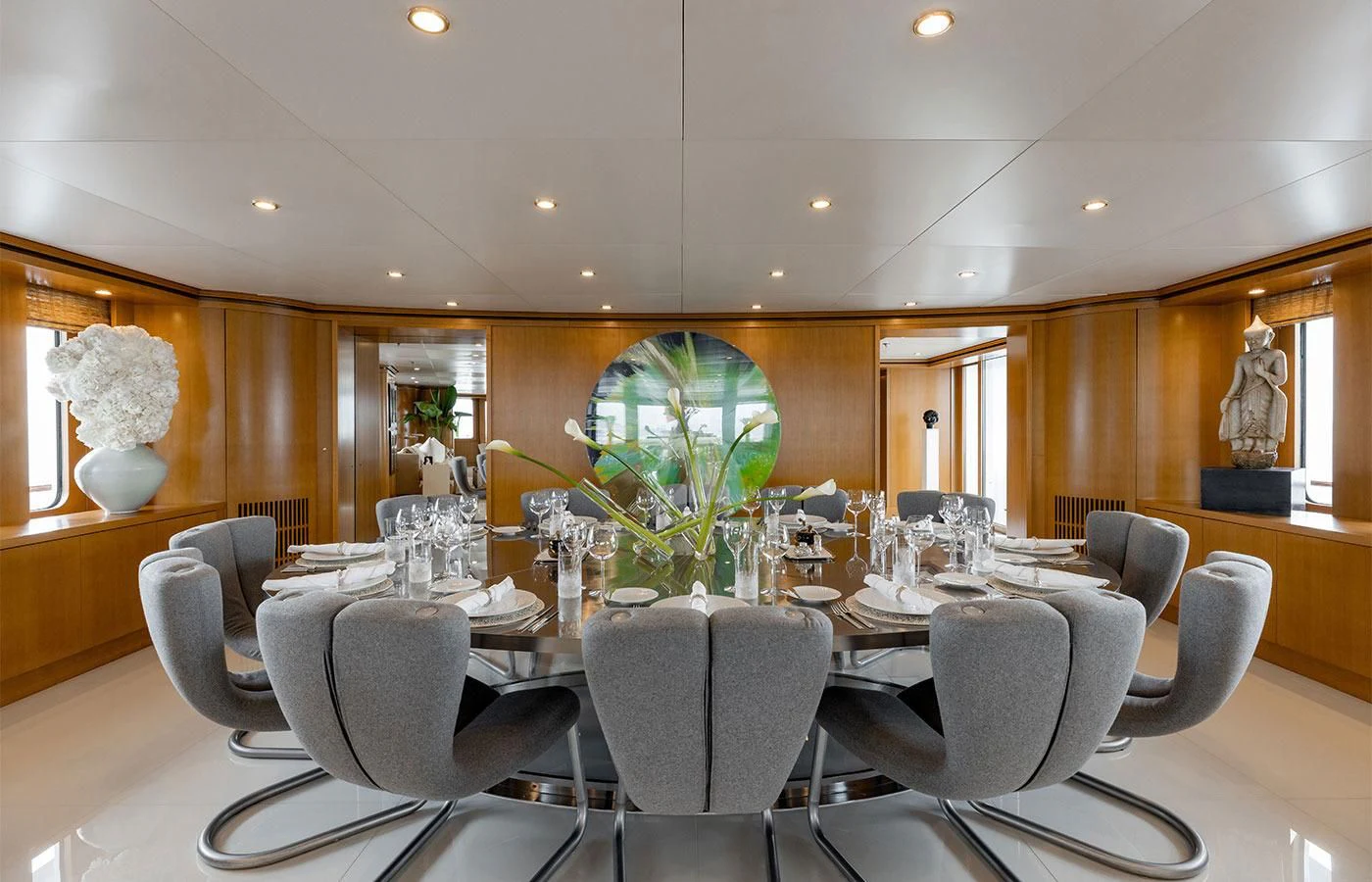 a large room with a large table and chairs aboard TREEHOUSE Yacht for Sale