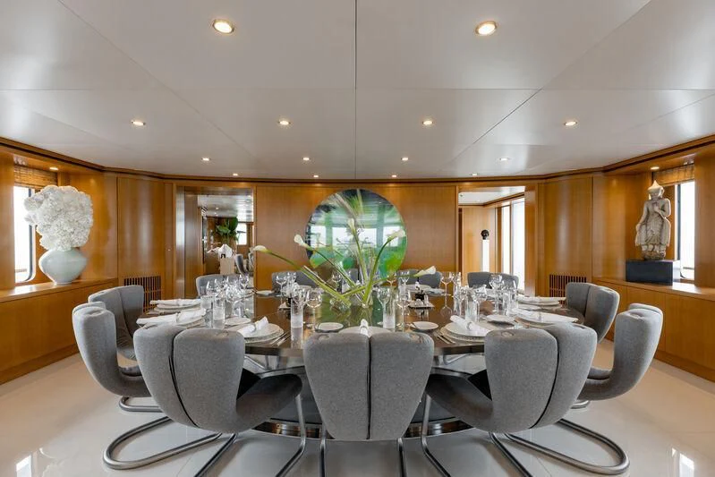 a large room with a large table and chairs aboard TREEHOUSE Yacht for Sale