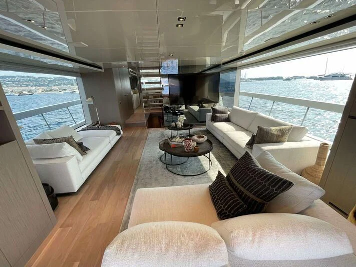 a living room with a large window aboard SPARTAN TIME Yacht for Sale