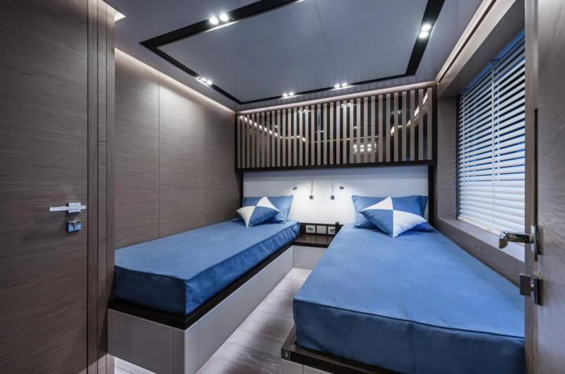 a room with two beds aboard ZOUT Yacht for Sale