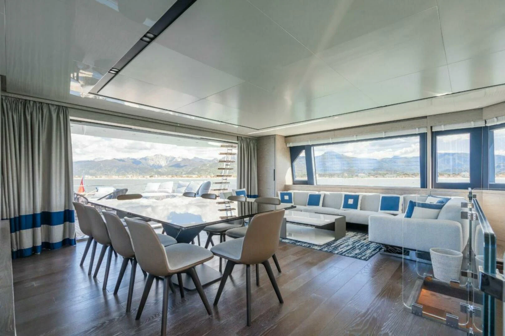 a room with a couch and a table and chairs aboard ZOUT Yacht for Sale