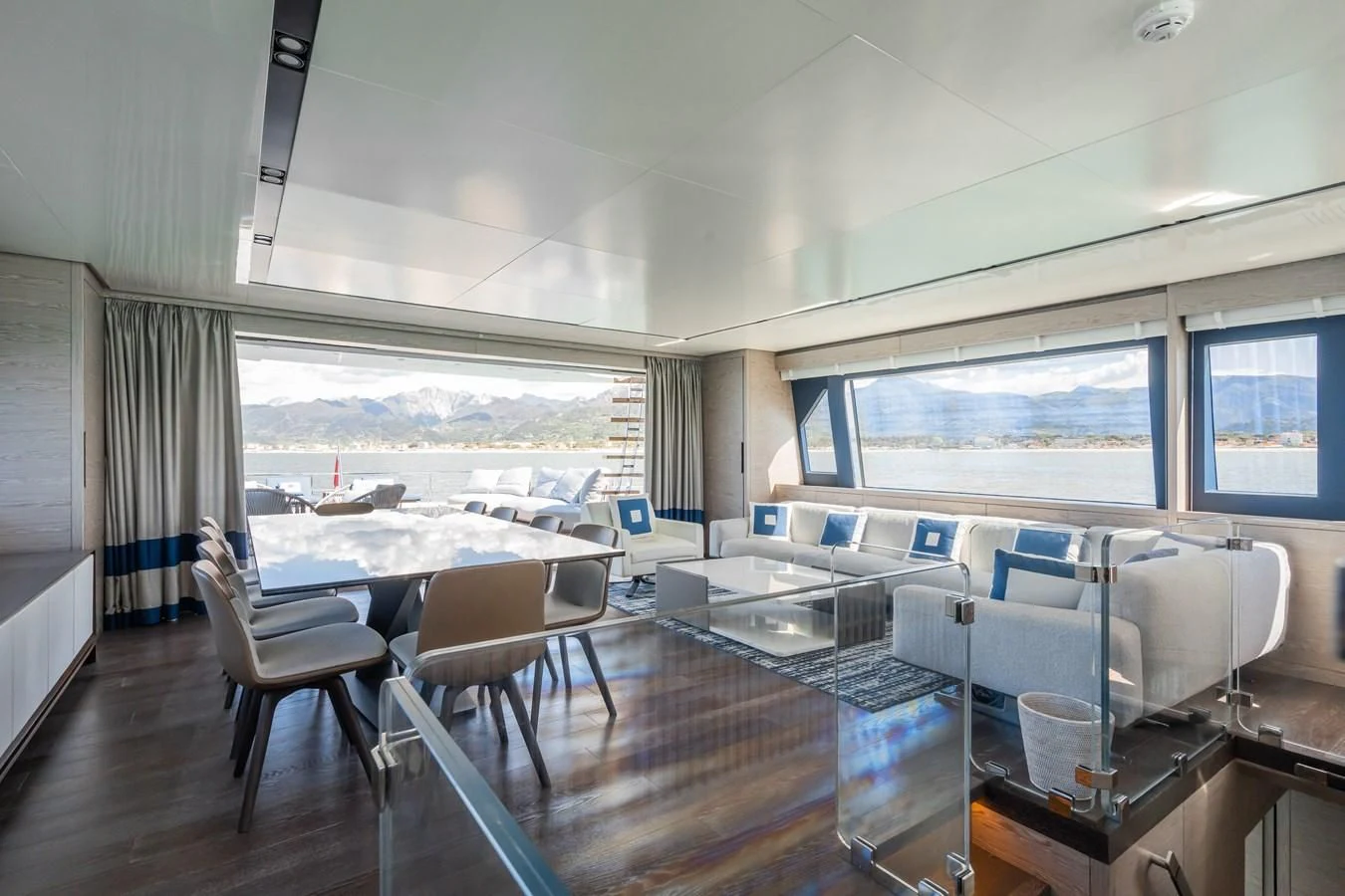a room with a table chairs and a large window aboard ZOUT Yacht for Sale