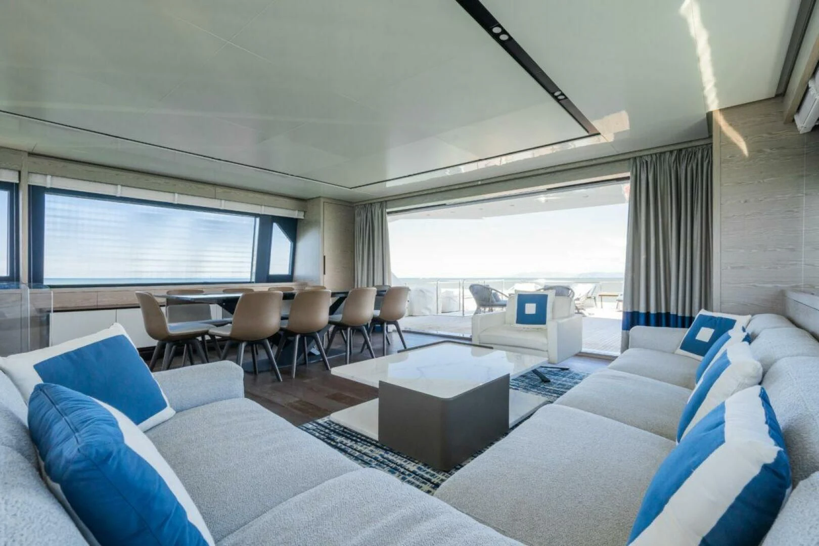 a room with a large bed and a large window aboard ZOUT Yacht for Sale