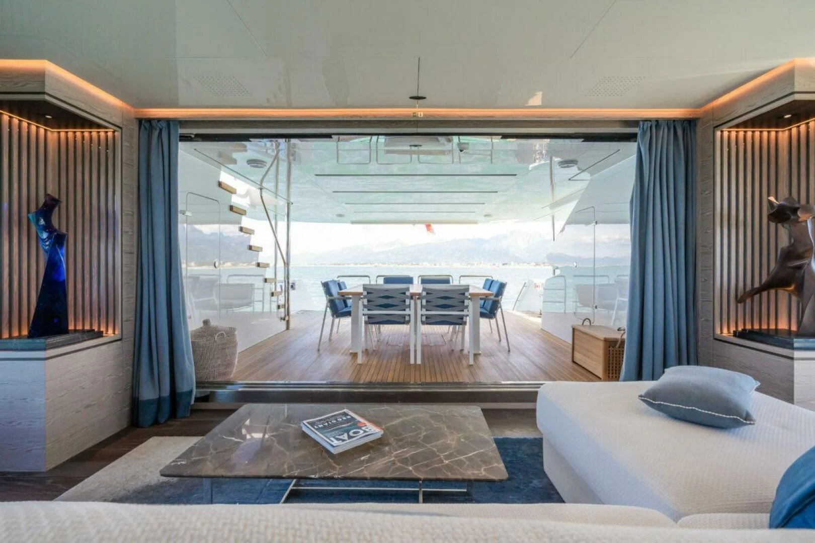 a room with a bed and a table aboard ZOUT Yacht for Sale