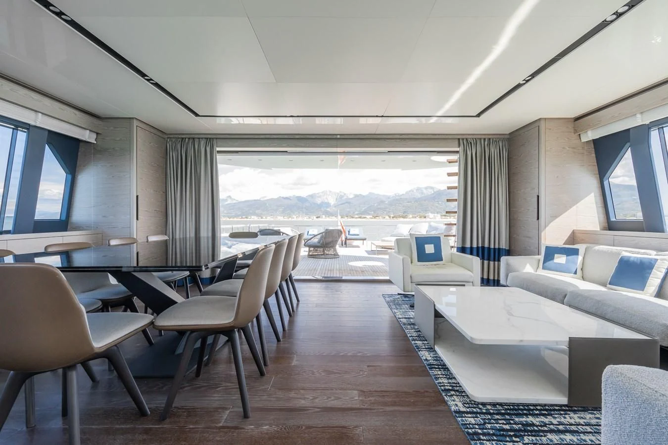 a room with a couch and a table and chairs aboard ZOUT Yacht for Sale