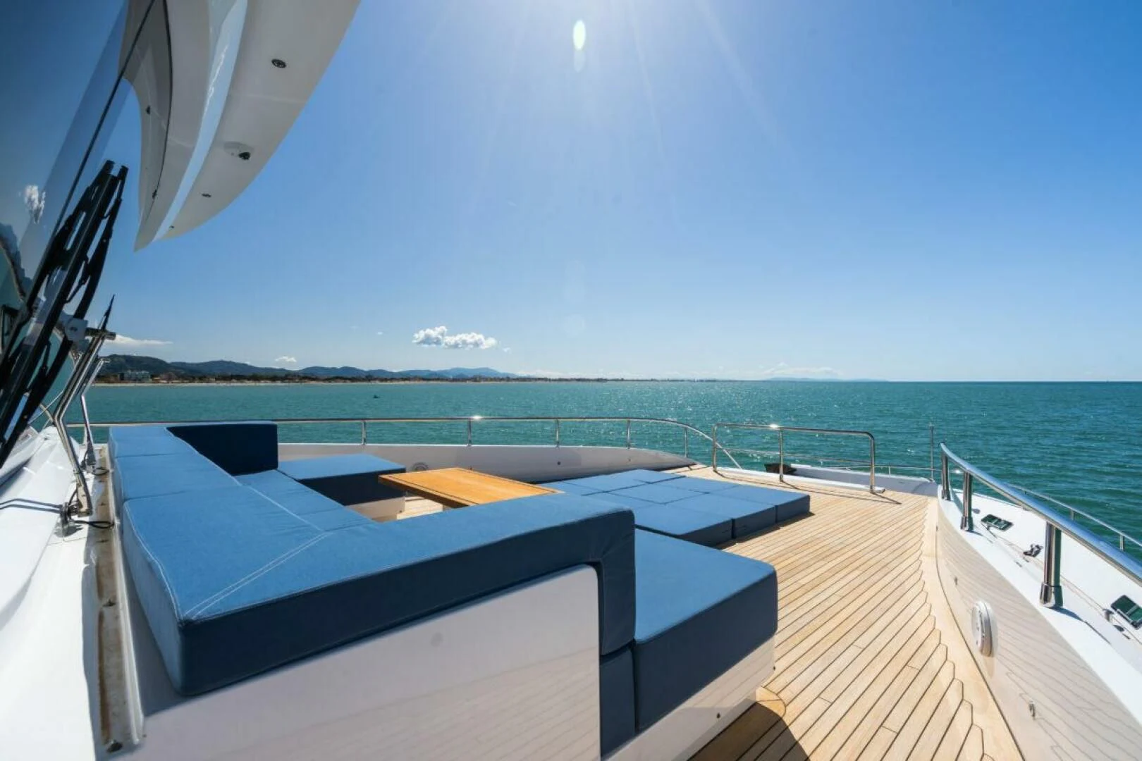 a deck with a view of the ocean and the ocean aboard ZOUT Yacht for Sale