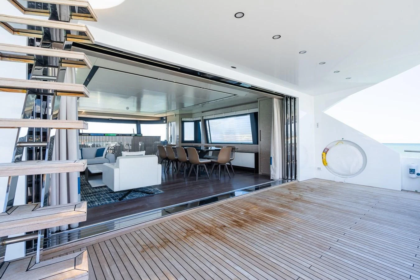 a living room with a wood floor aboard ZOUT Yacht for Sale