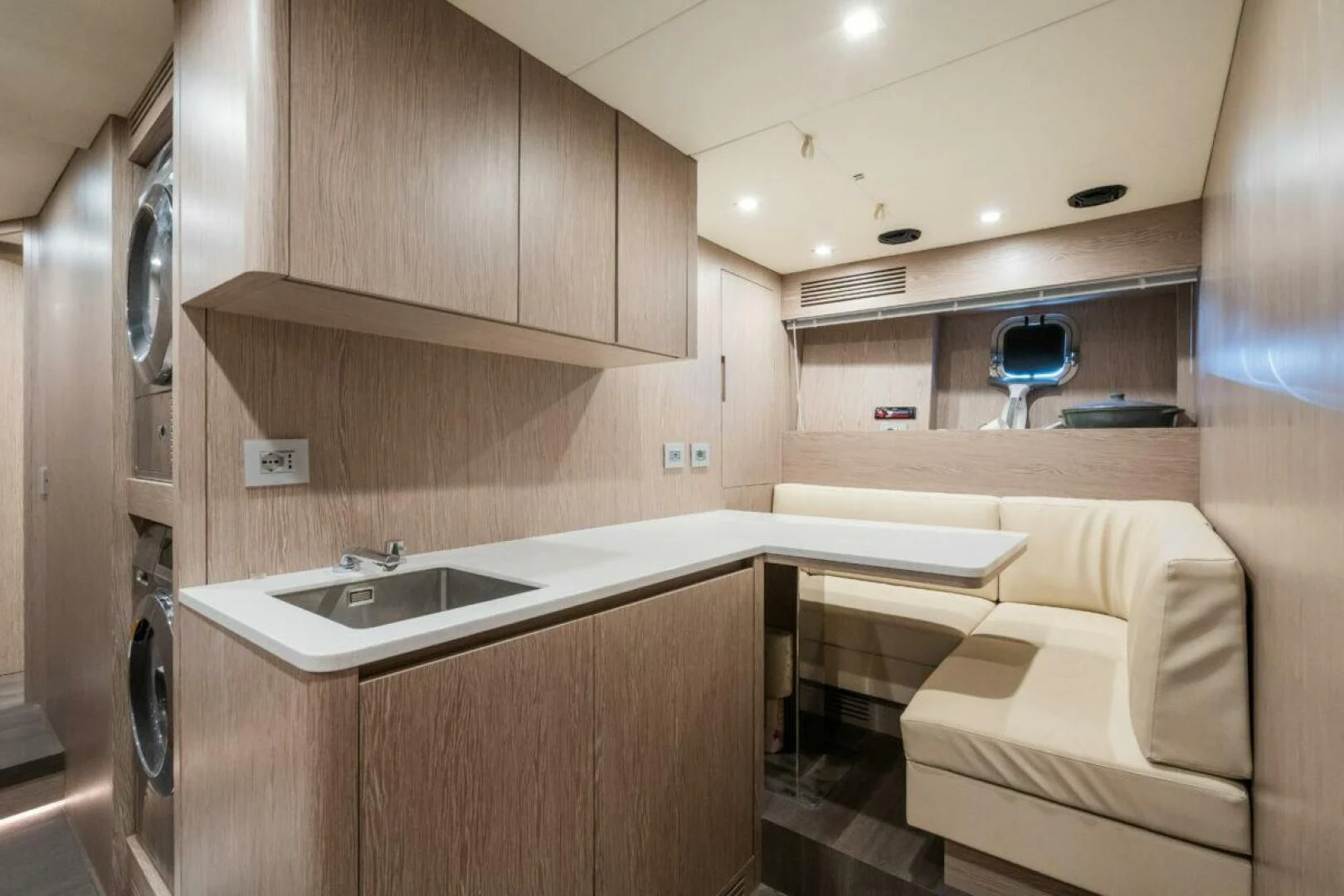 a bathroom with a bed and a sink aboard ZOUT Yacht for Sale