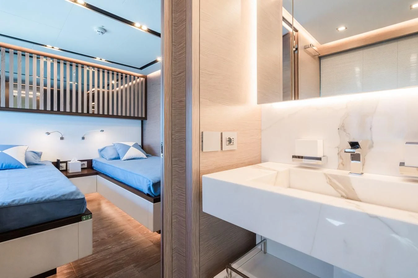 a bathroom with a tub sink and a bed aboard ZOUT Yacht for Sale
