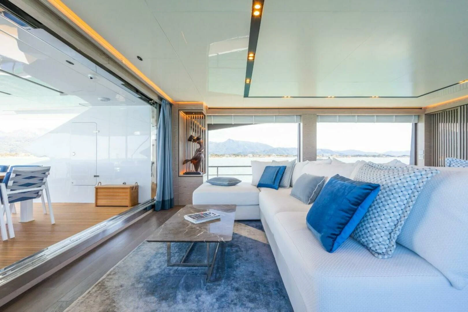 a room with a couch and a table aboard ZOUT Yacht for Sale