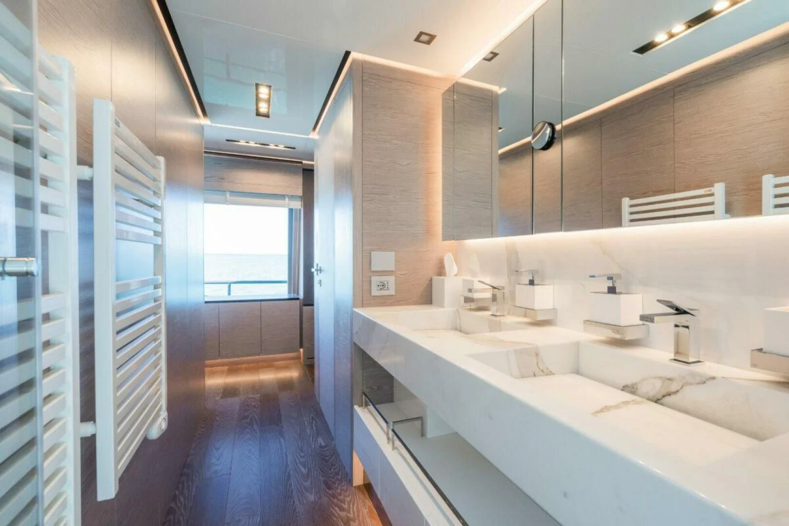 a bathroom with a long countertop aboard ZOUT Yacht for Sale