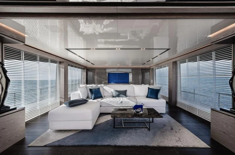a living room with a couch and a coffee table aboard ZOUT Yacht for Sale