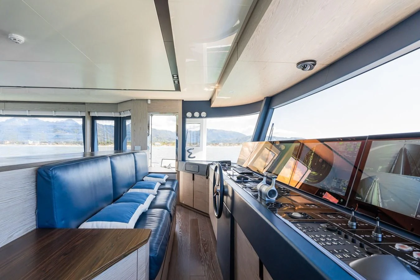 a large room with a large window and a large kitchen with a large open window aboard ZOUT Yacht for Sale