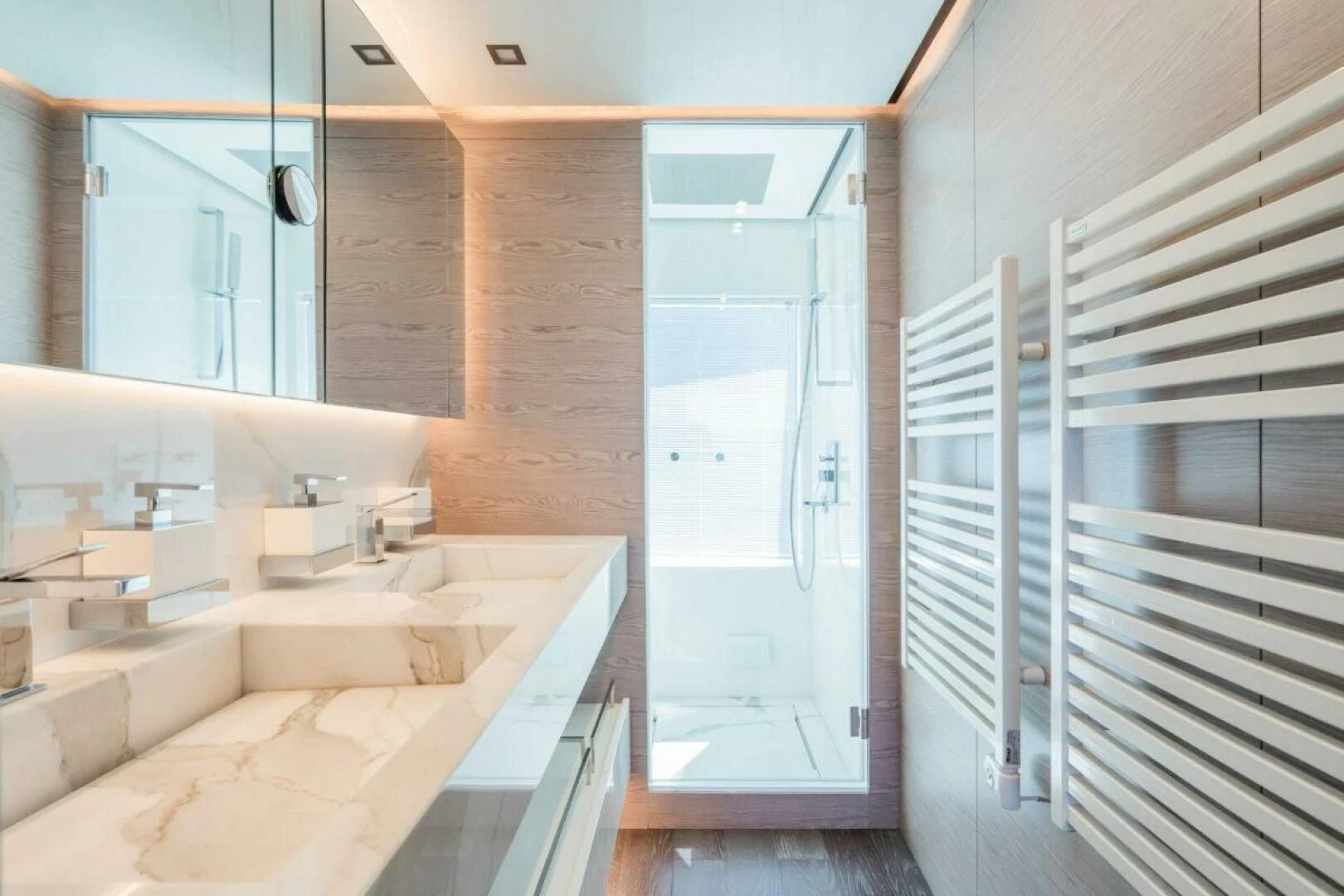 a bathroom with a tub sink and cabinets aboard ZOUT Yacht for Sale