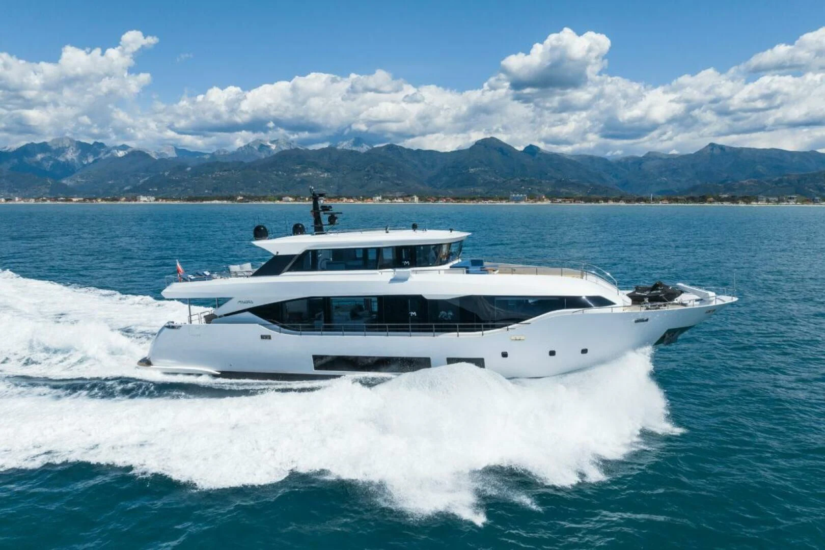 a white boat on water aboard ZOUT Yacht for Sale