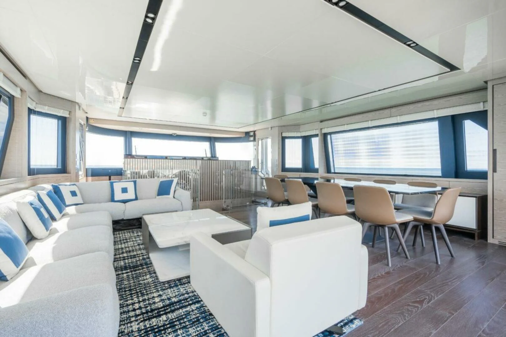 a room with a couch and a table and chairs aboard ZOUT Yacht for Sale