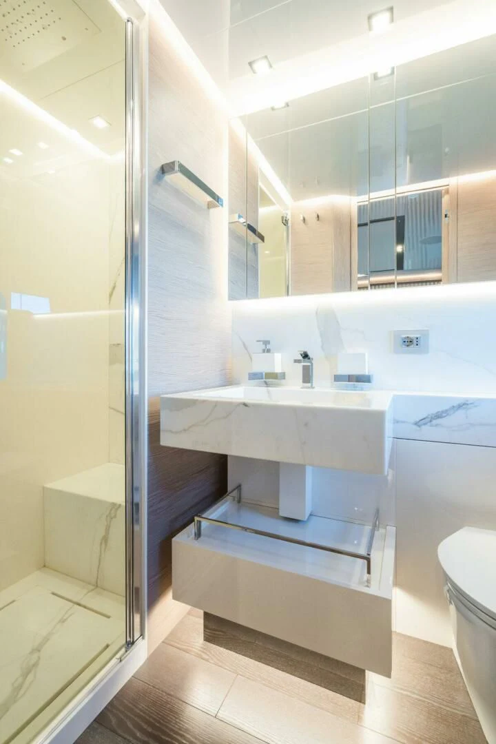 a bathroom with a sink and a mirror aboard ZOUT Yacht for Sale