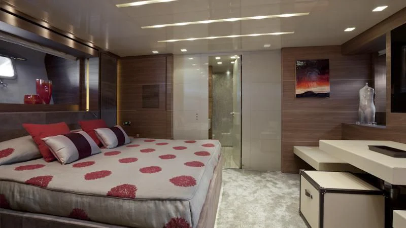 a room with a bed and a desk aboard ASTERI Yacht for Sale
