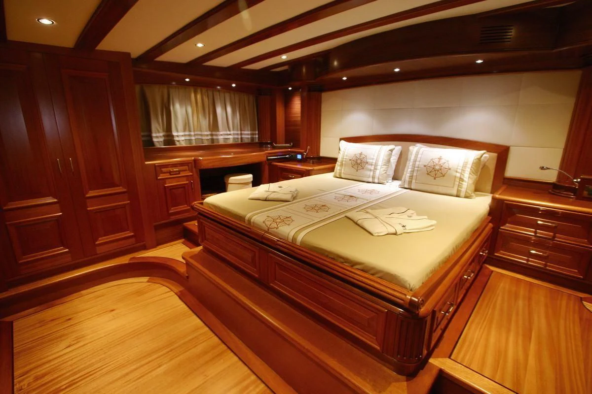 a bed in a room aboard KAYA GUNERI V Yacht for Sale