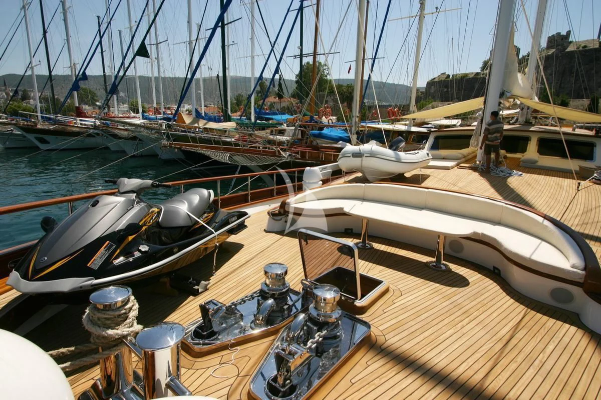 a group of boats sit on a dock aboard KAYA GUNERI V Yacht for Sale