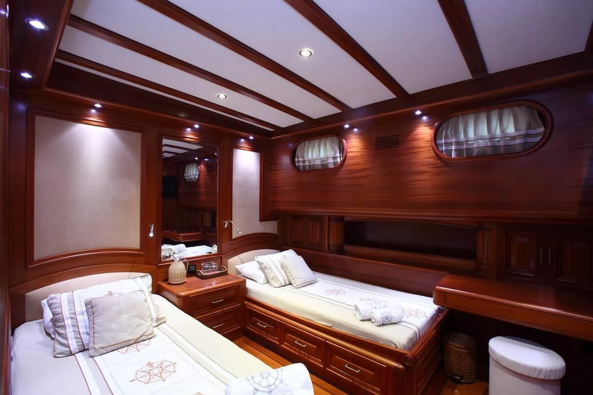 a room with two beds aboard KAYA GUNERI V Yacht for Sale