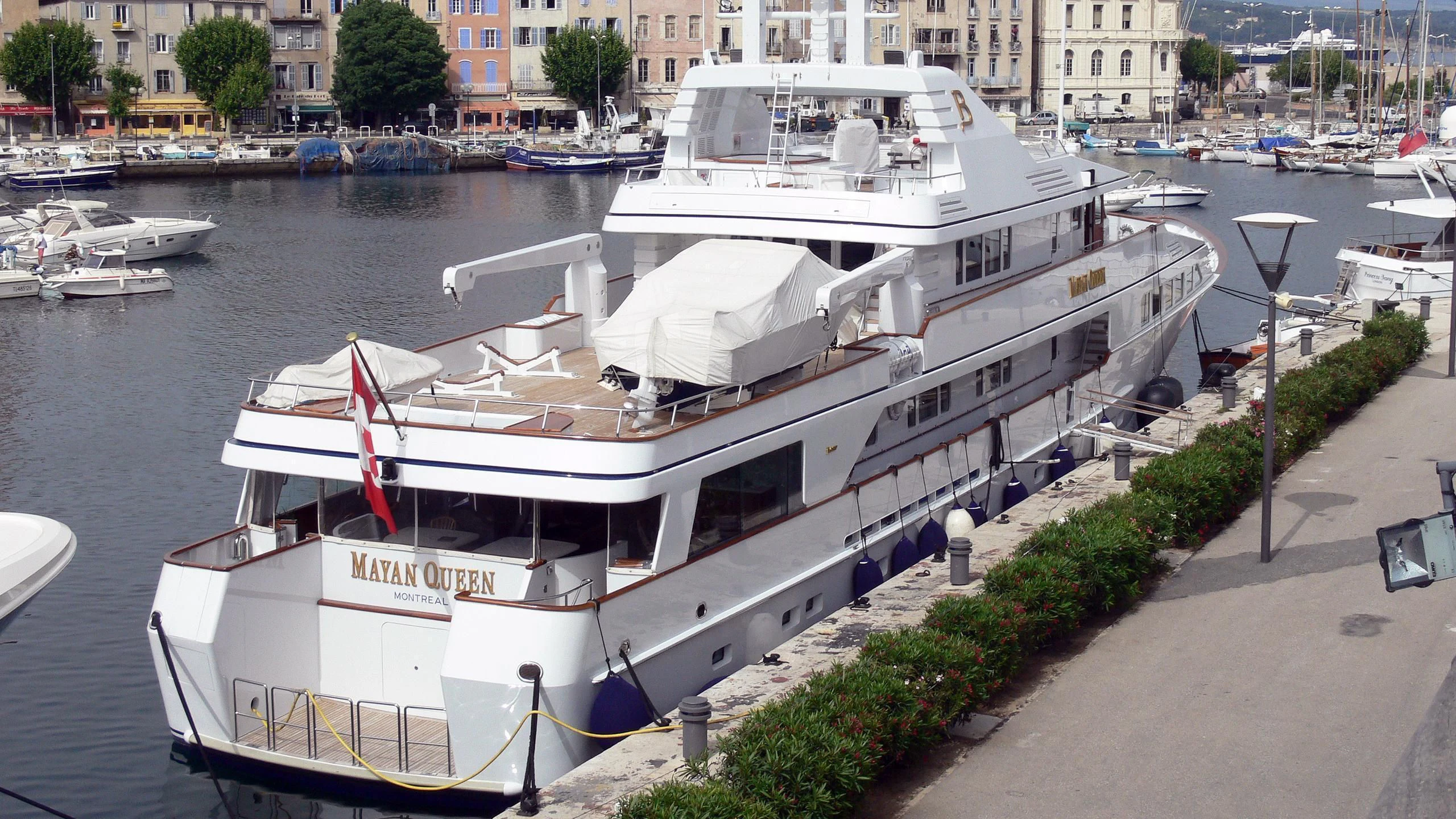 a boat docked at a pier aboard EMERALD Yacht for Charter