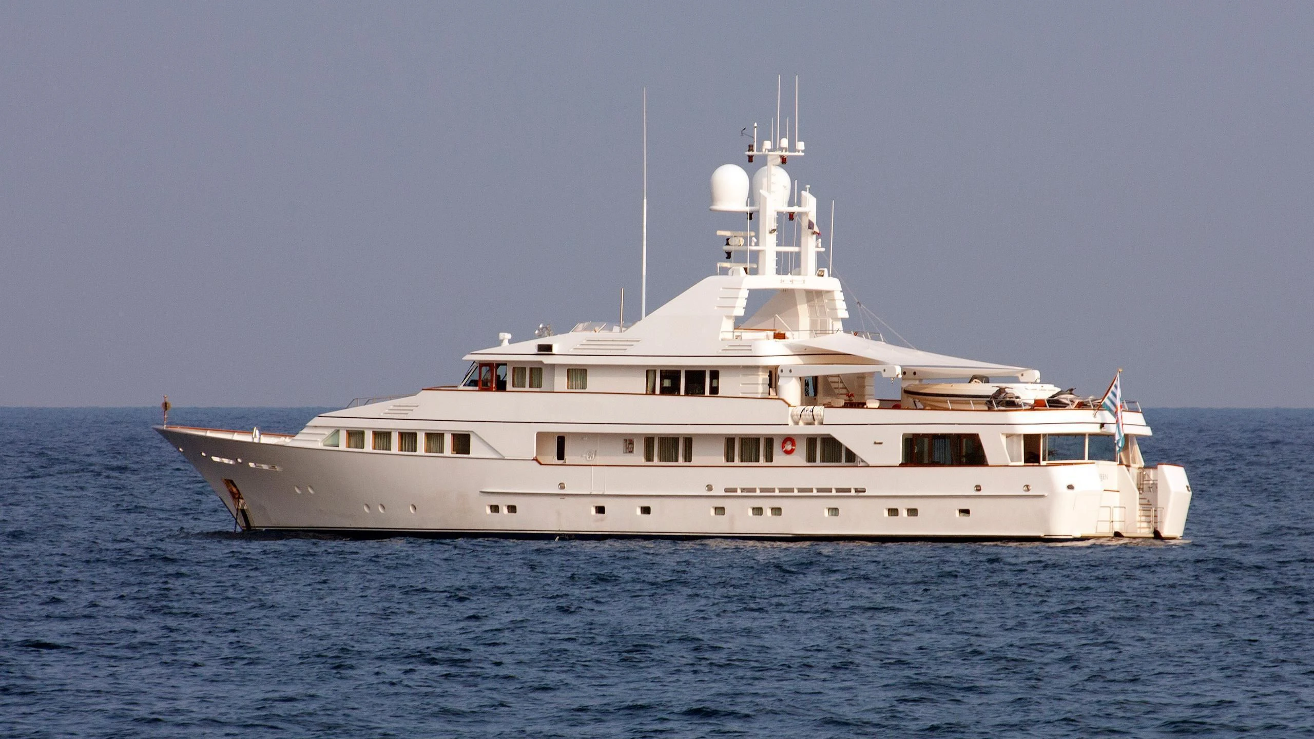 a large white boat in the water aboard EMERALD Yacht for Charter