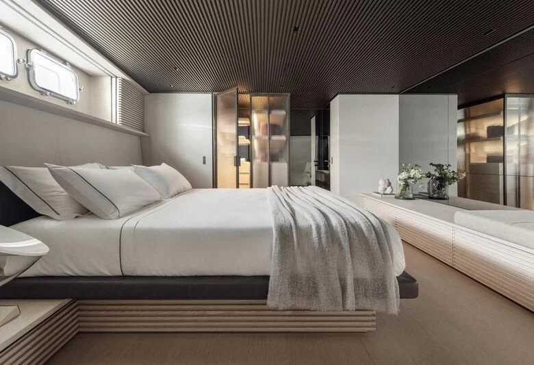 a large bed in a room aboard STEEL IT Yacht for Sale