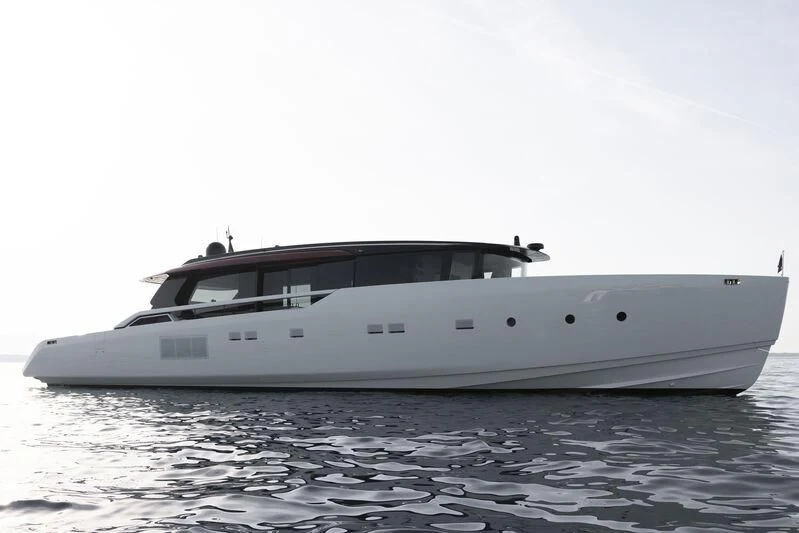 a white yacht on the water aboard STEEL IT Yacht for Sale