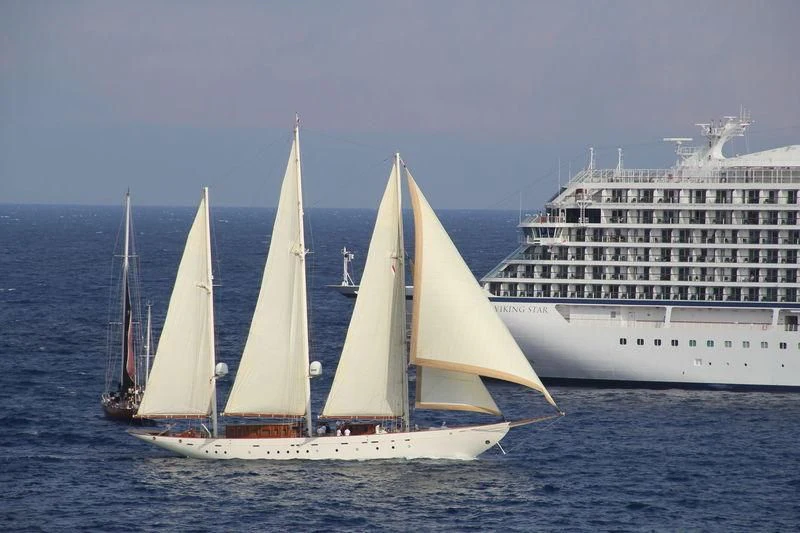 a group of sailboats in the water aboard XARIFA 1927 Yacht for Sale