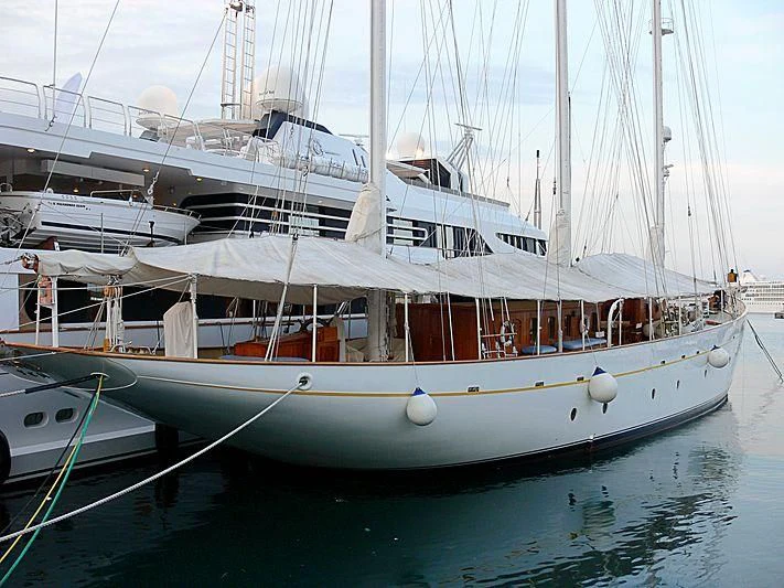 a boat docked at a pier aboard XARIFA 1927 Yacht for Sale