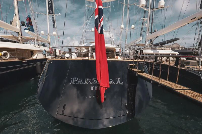 a boat with a red ribbon aboard PARSIFAL III Yacht for Charter