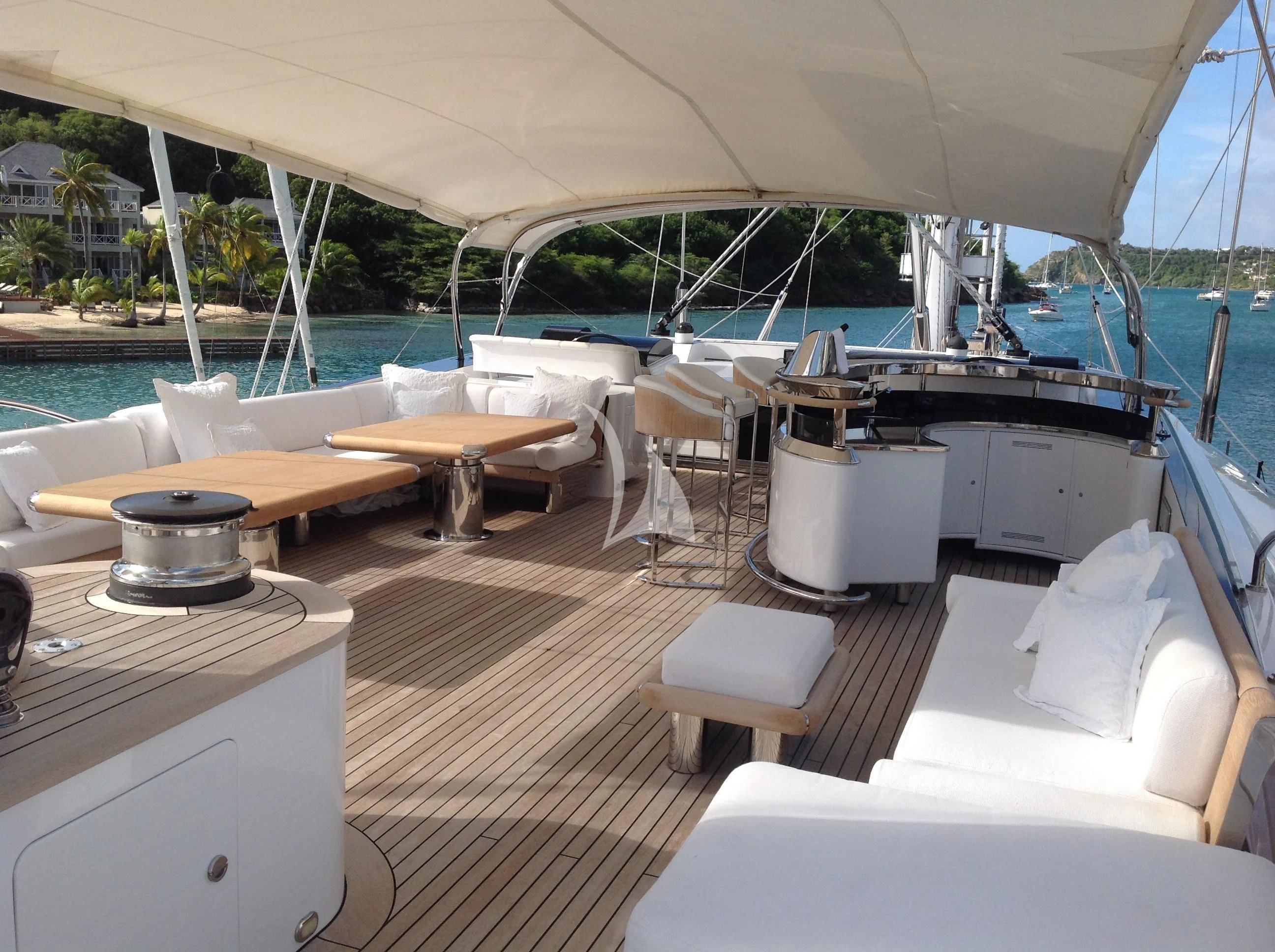 a boat with a table and chairs aboard PARSIFAL III Yacht for Charter