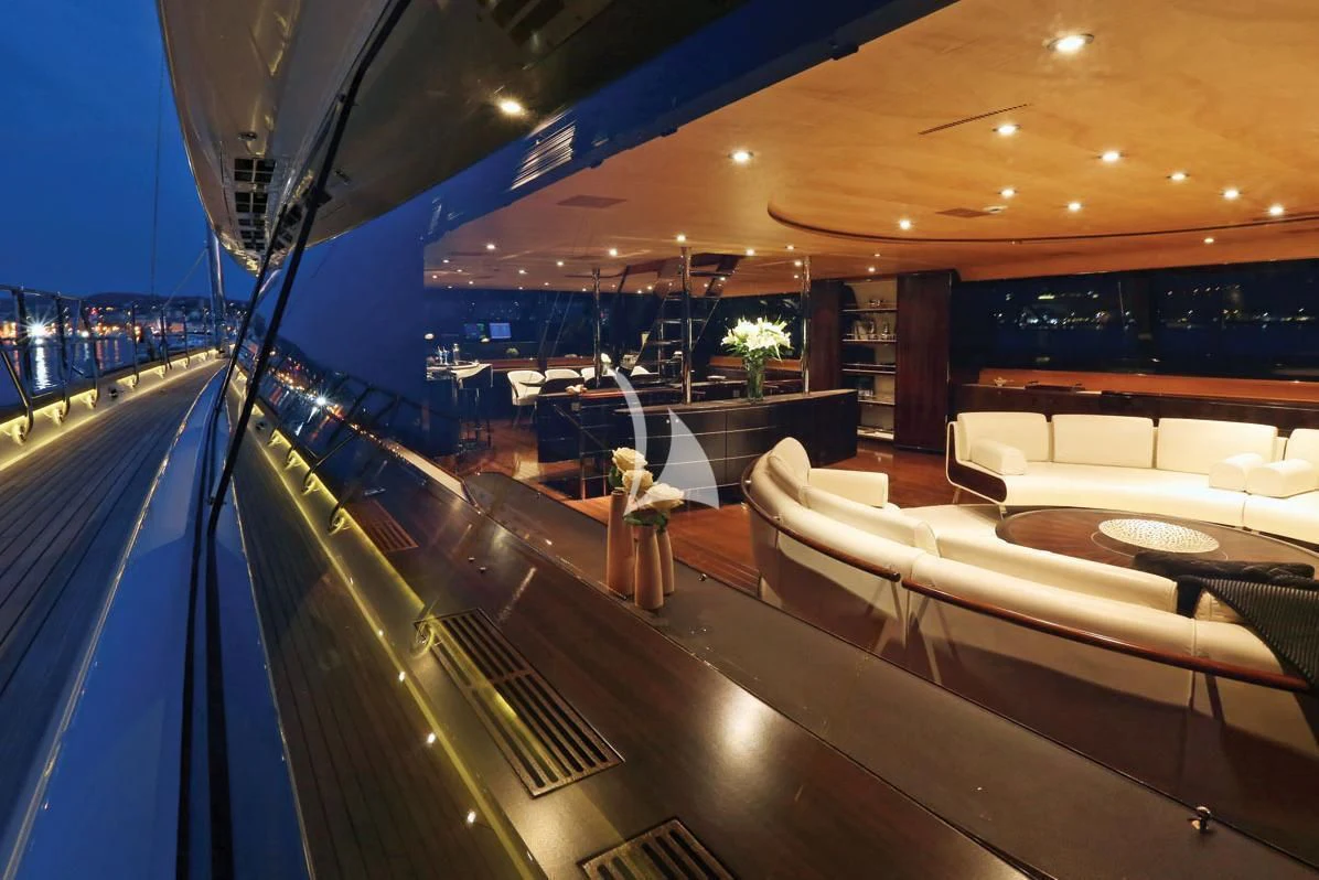 a swimming pool with a large lounge area and a large pool aboard PARSIFAL III Yacht for Charter