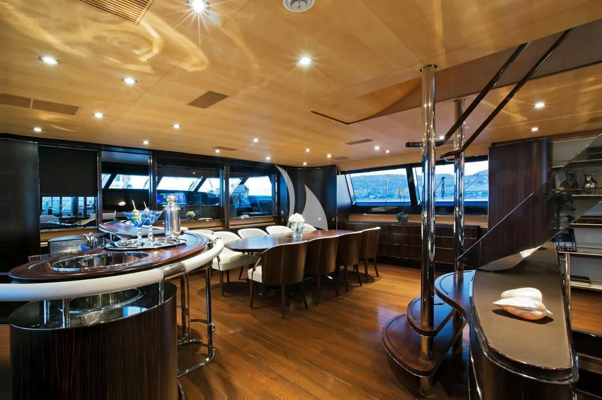 a room with tables and chairs aboard PARSIFAL III Yacht for Charter