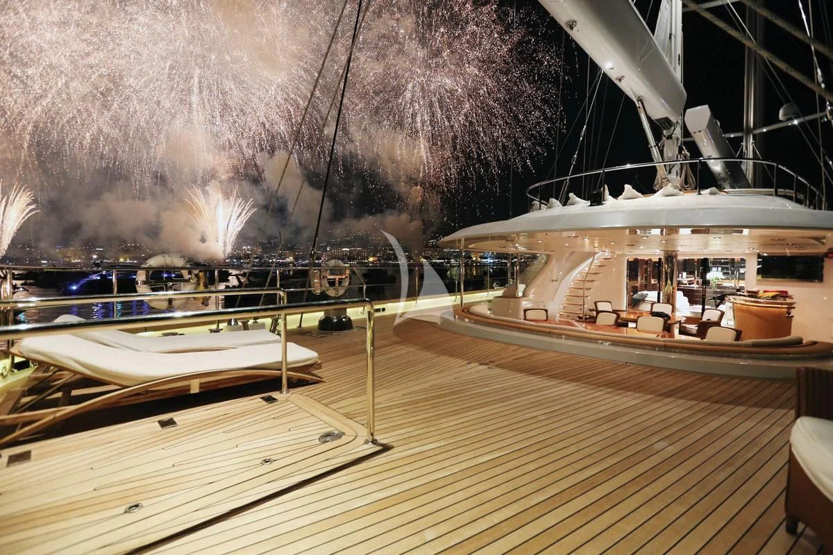 a large room with a large fire aboard PARSIFAL III Yacht for Charter