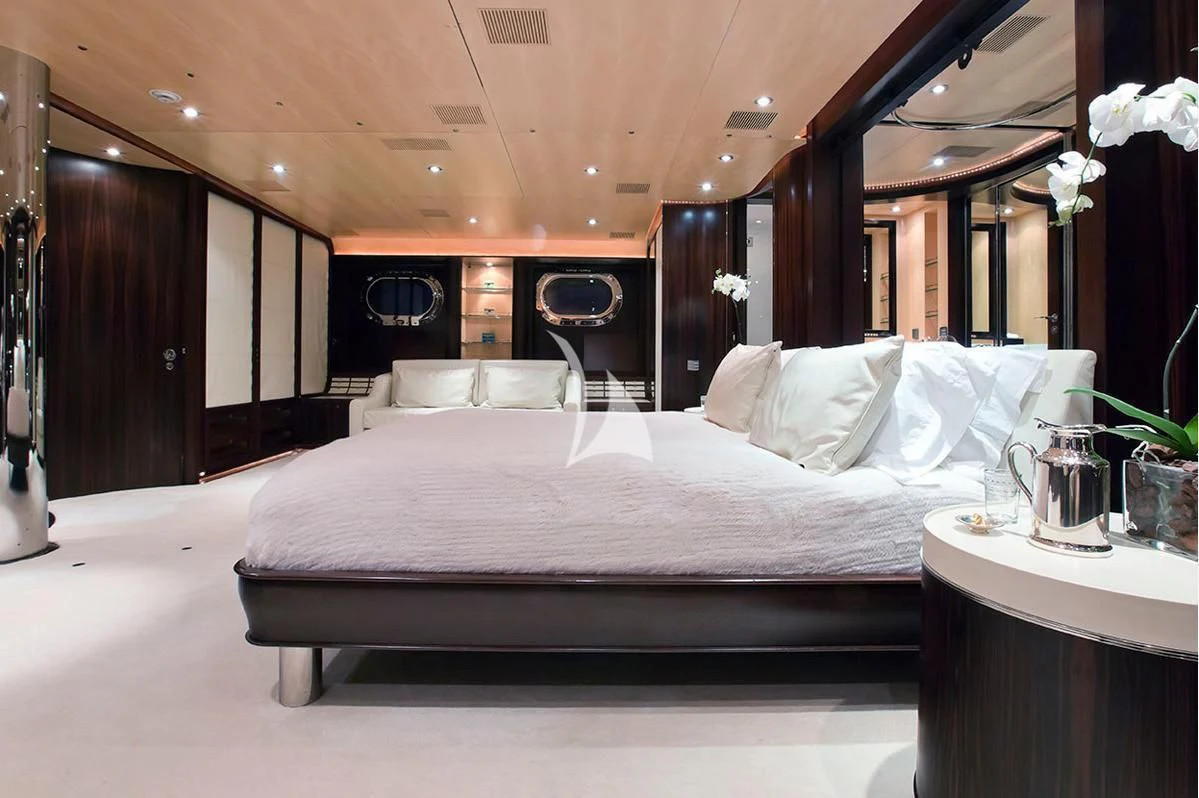 a bed with white sheets aboard PARSIFAL III Yacht for Charter