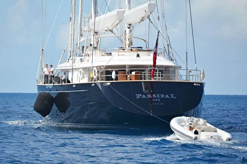 a boat with a couple of people on it aboard PARSIFAL III Yacht for Charter