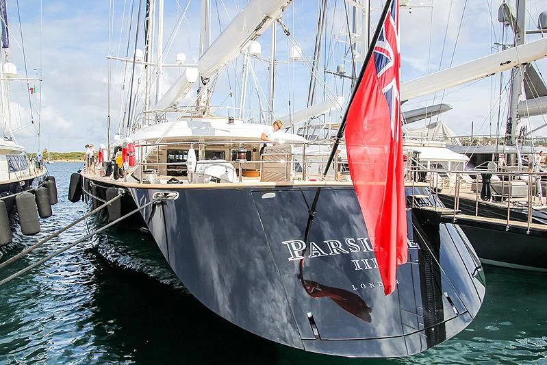 a boat with a red and white sail aboard PARSIFAL III Yacht for Charter