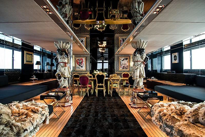 a room with a chandelier and chairs aboard MY FAIR LADY Yacht for Sale