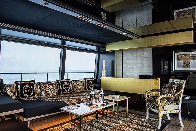 a living room with a couch and a coffee table aboard MY FAIR LADY Yacht for Sale