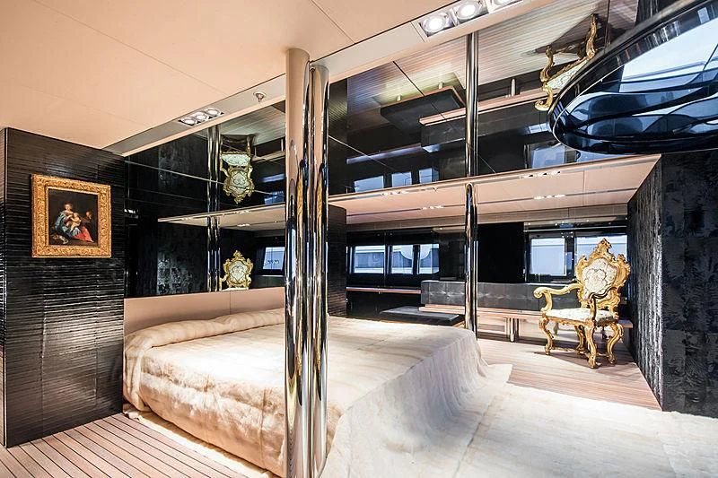 a room with a fireplace and a large mirror aboard MY FAIR LADY Yacht for Sale