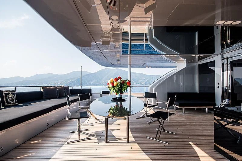 a room with a table and chairs aboard MY FAIR LADY Yacht for Sale