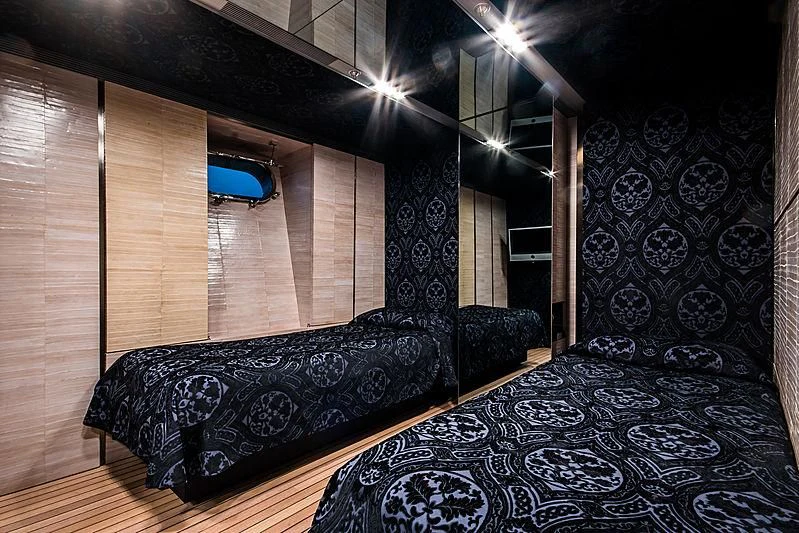 a room with a bed and a chair aboard MY FAIR LADY Yacht for Sale