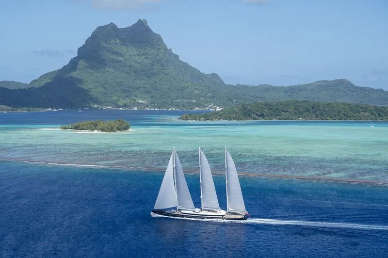 a small white boat in the water aboard SEA EAGLE Yacht for Sale