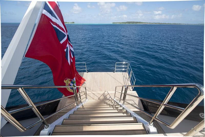 a boat with a flag on the front aboard SEA EAGLE Yacht for Sale