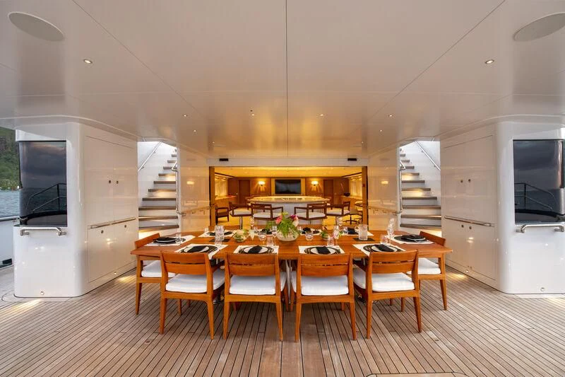 a kitchen with a table and chairs aboard SEA EAGLE Yacht for Sale