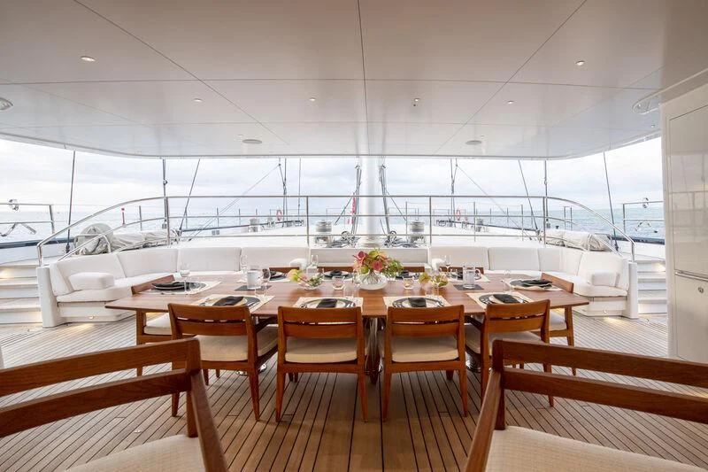a room with tables and chairs aboard SEA EAGLE Yacht for Sale