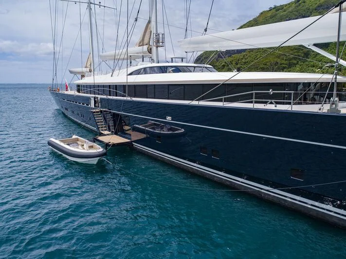 a boat docked at a pier aboard SEA EAGLE Yacht for Sale